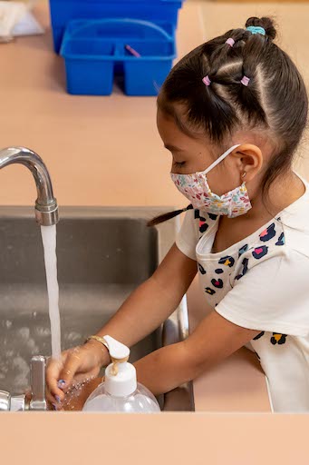 Student washing hands