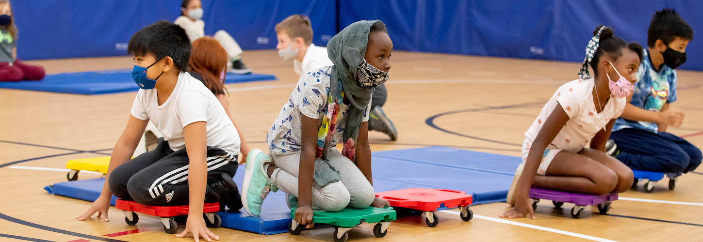 Students playing in gym class